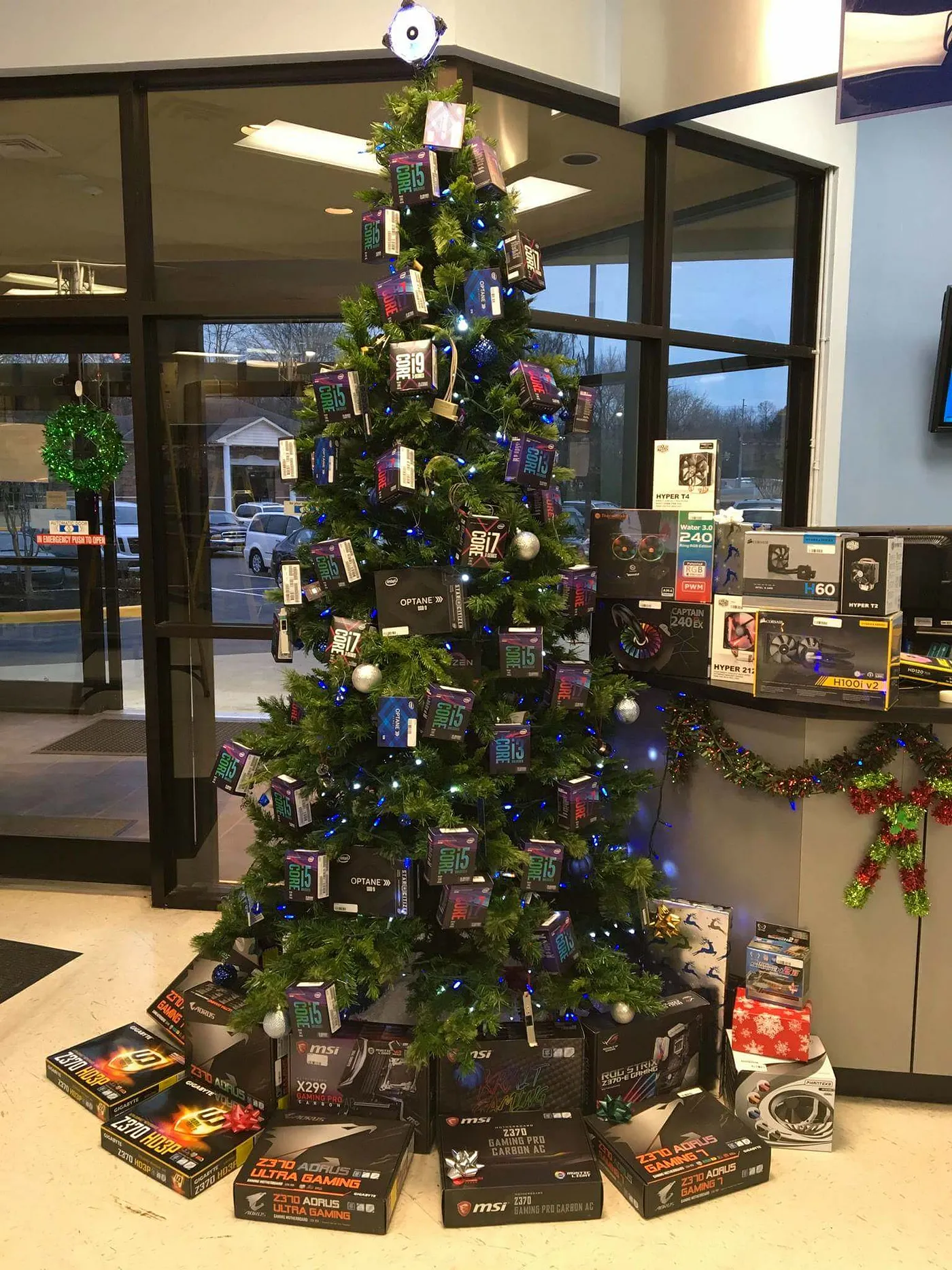 When I was just learning about PC hardware, in the holiday season of 2017, I found this picture on Reddit, and it fits the scenario at that time as well. Intel was everywhere, but (and it’s hard to spot) AMD is just there in the middle of the tree hidden by some branches, and is soon going to knock down Intel’s monopoly. Just a solitary Ryzen in the tree of Coffee Lake. Credit: u/camaroguy719 on r/pcmasterrace. Hint: Spot the large “Optane” box at the height of the counter on the tree.